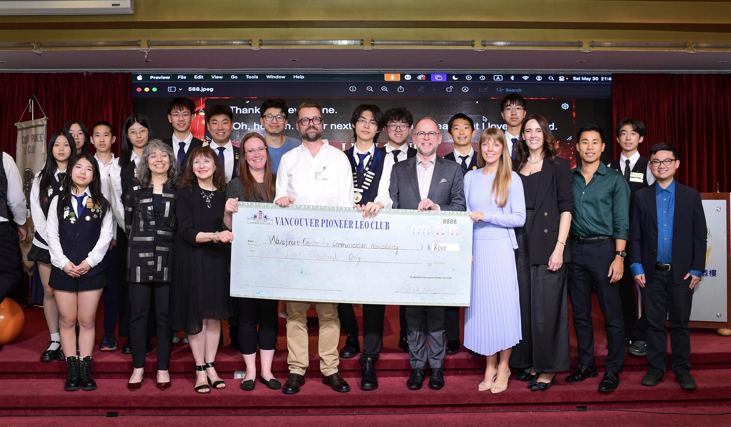 Wavefront Centre staff and Vancouver Pioneer LEO Club members stand together, on behalf of people who are Deaf, DeafBlind and Hard of Hearing, while holding a cheque for a generous $8,000 donation to Wavefront Centre.