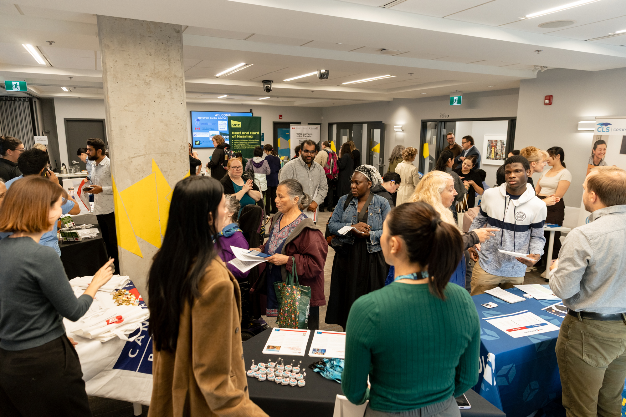 Job seekers and employer representatives connect at information tables during Wavefront Centre’s busy 2026 Job Fair.
